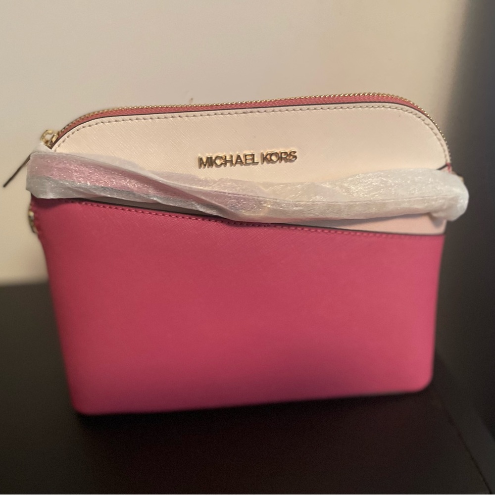 Brand new Michael Kors bag. Never worn, original price $397.
